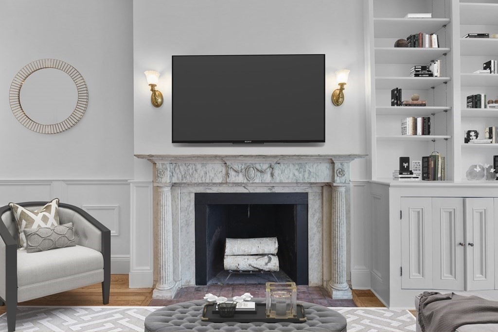 125 Beacon Street, Unit 5 Boston, MA 02116 - Photo 4 of 13 a living room with furniture and a fireplace