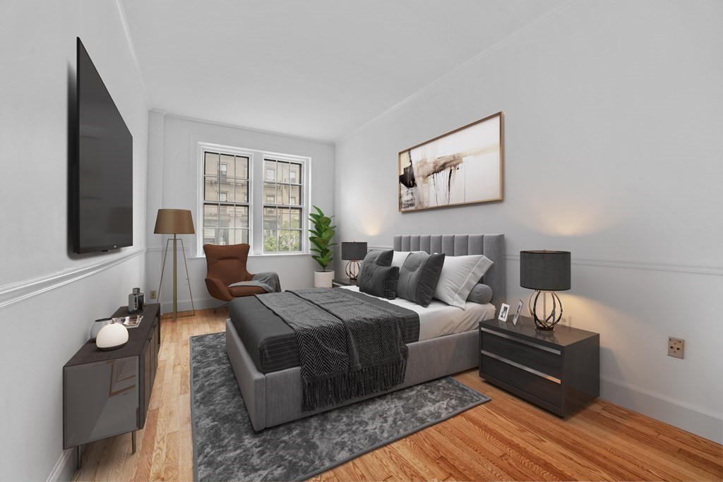 125 Beacon Street, Unit 5 Boston, MA 02116 - Photo 7 of 13 a bedroom with a bed and wooden floor