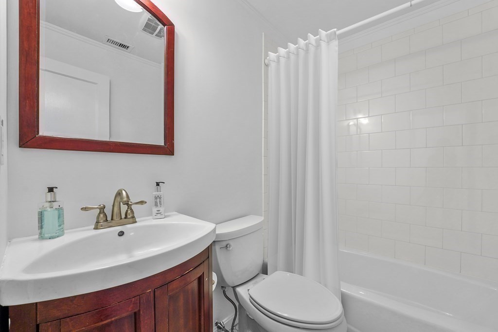 125 Beacon Street, Unit 5 Boston, MA 02116 - Photo 9 of 13 a bathroom with a sink a toilet and shower