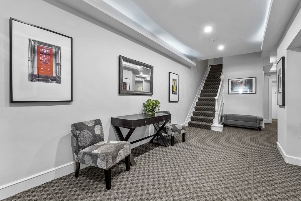 125 Beacon Street, Unit 5 Boston, MA 02116 - Photo 10 of 13 a living room with furniture and a stairs