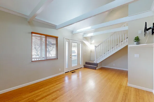 a view of an entryway with wooden floor