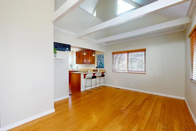 a room with a bed and a flat screen tv