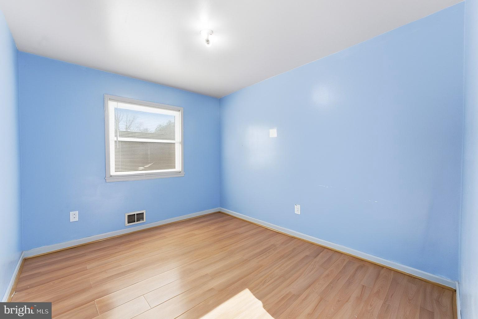 7812 Amherst Drive Manassas, VA 20111 - Photo 11 of 36 a view of an empty room with wooden floor