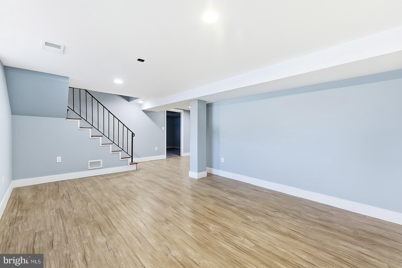 7812 Amherst Drive Manassas, VA 20111 - Photo 17 of 36 a view of an empty room with wooden floor