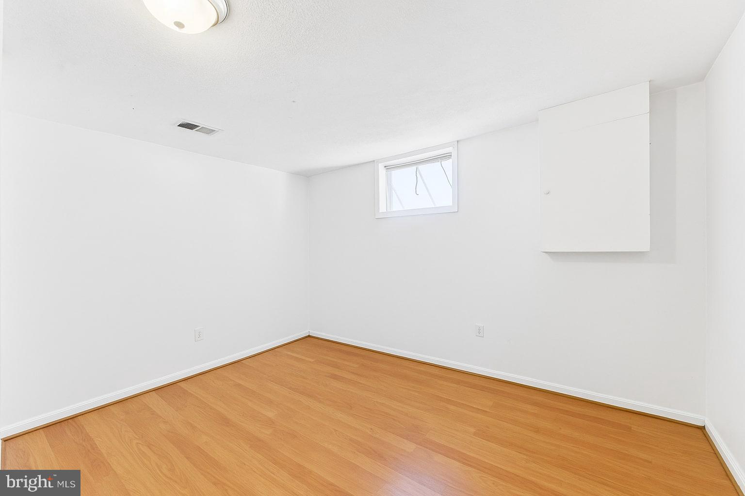 7812 Amherst Drive Manassas, VA 20111 - Photo 19 of 36 a view of empty room with wooden floor