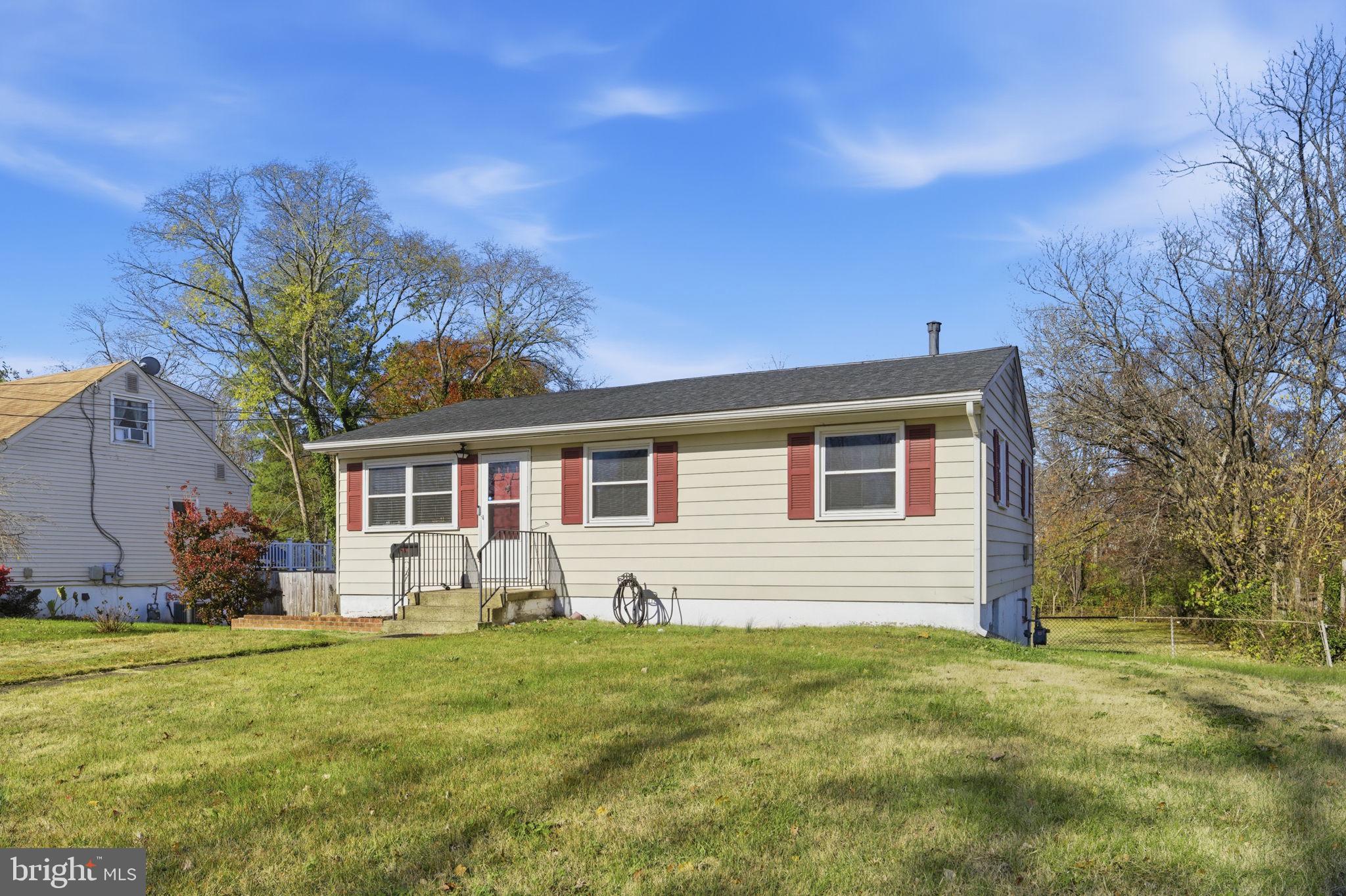7812 Amherst Drive Manassas, VA 20111 - Photo 2 of 36 a front view of house with yard and green space