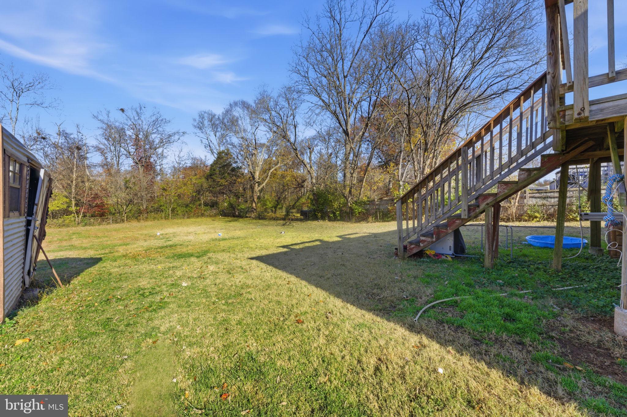 7812 Amherst Drive Manassas, VA 20111 - Photo 27 of 36 a view of yard with swimming pool and trees