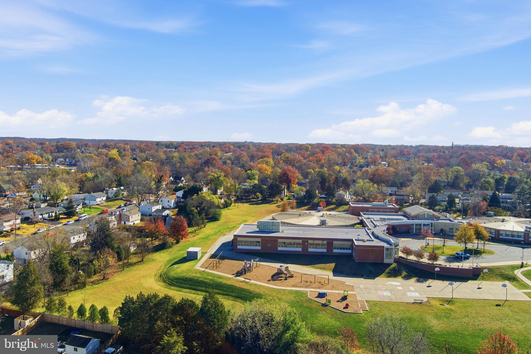 7812 Amherst Drive Manassas, VA 20111 - Photo 32 of 36 a view of a city with lots of residential buildings ocean and mountain view in back