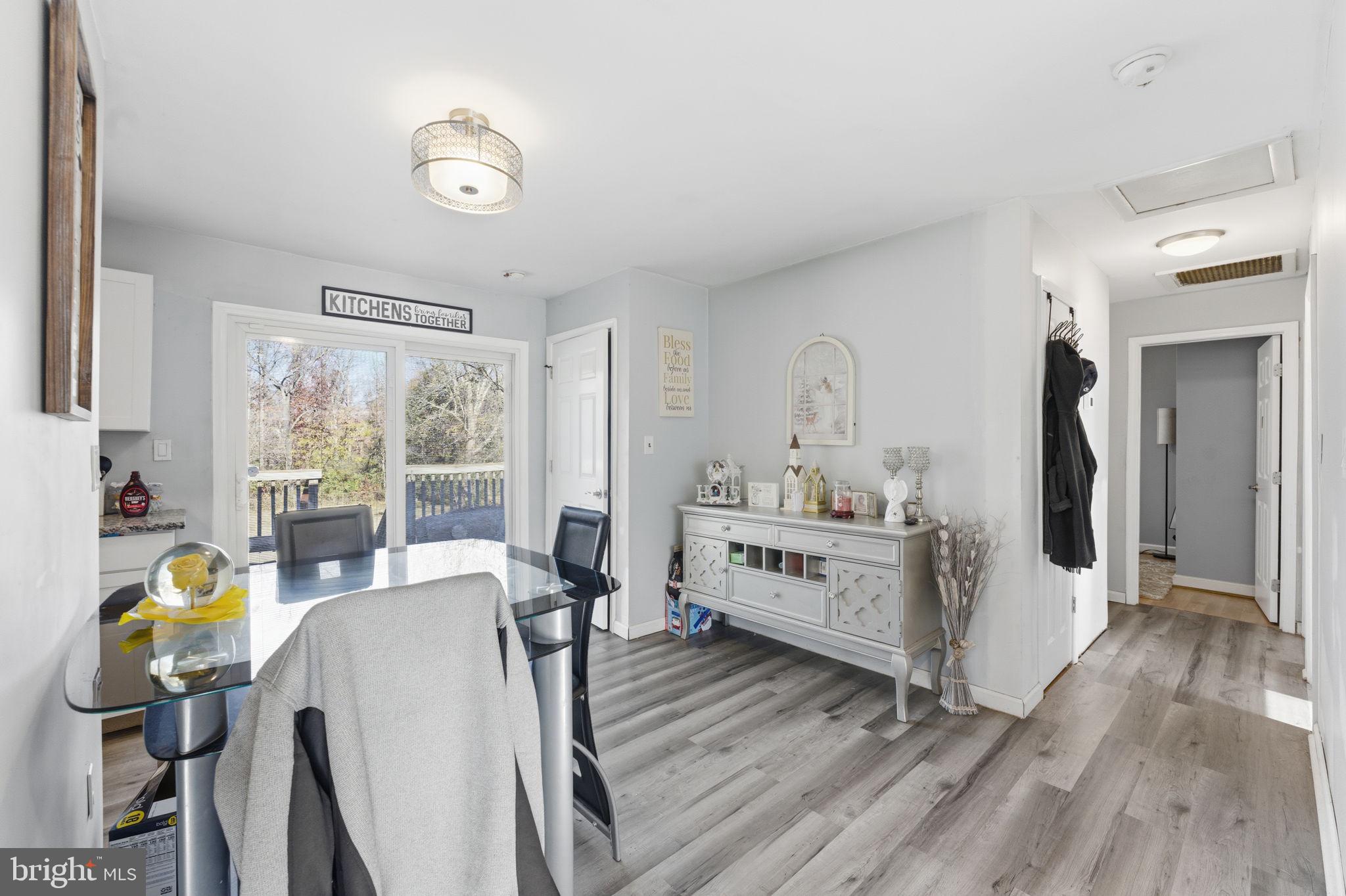7812 Amherst Drive Manassas, VA 20111 - Photo 5 of 36 a view of a dining room with furniture window and wooden floor