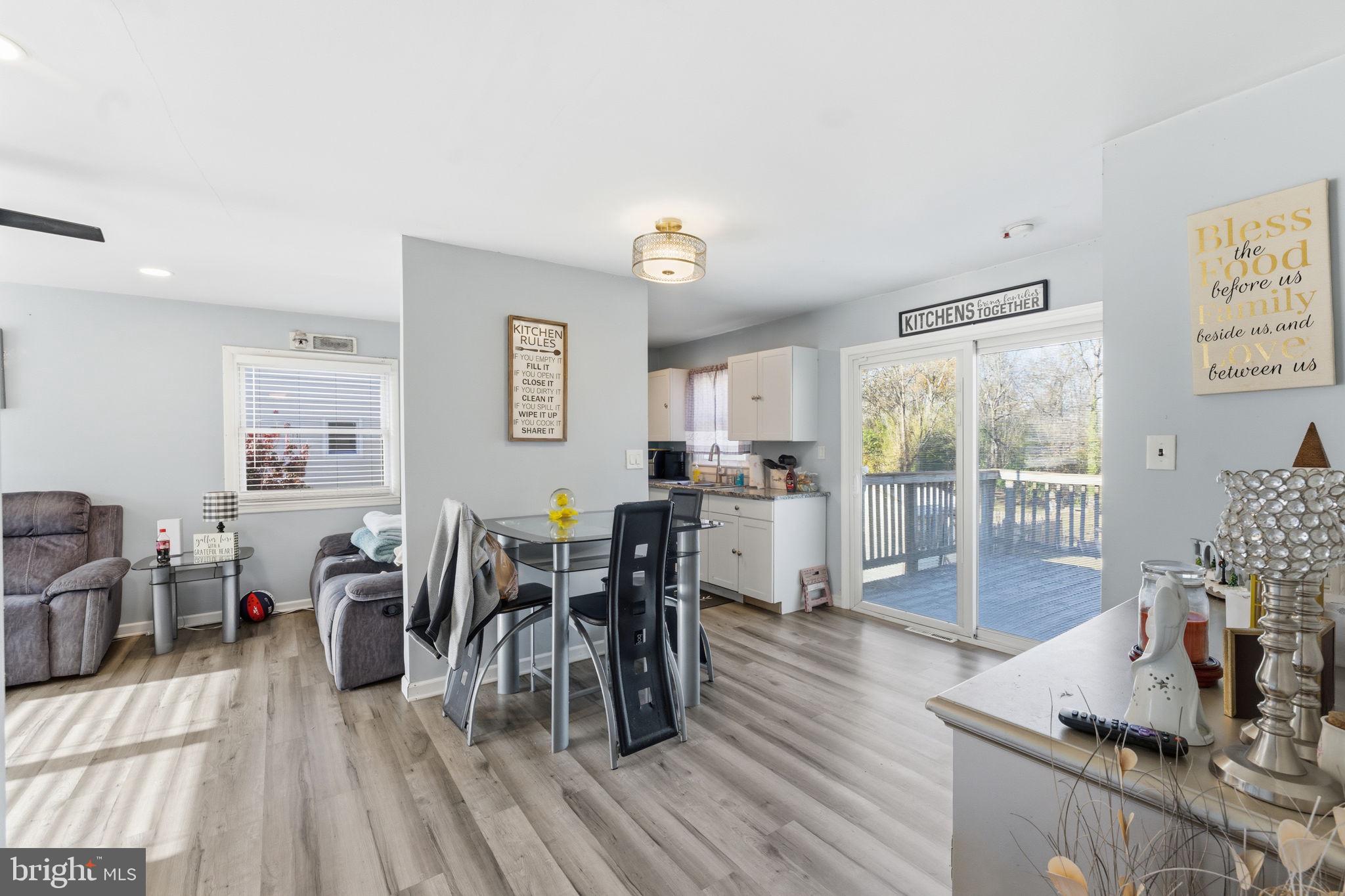 7812 Amherst Drive Manassas, VA 20111 - Photo 6 of 36 a view of a dining room with furniture and wooden floor