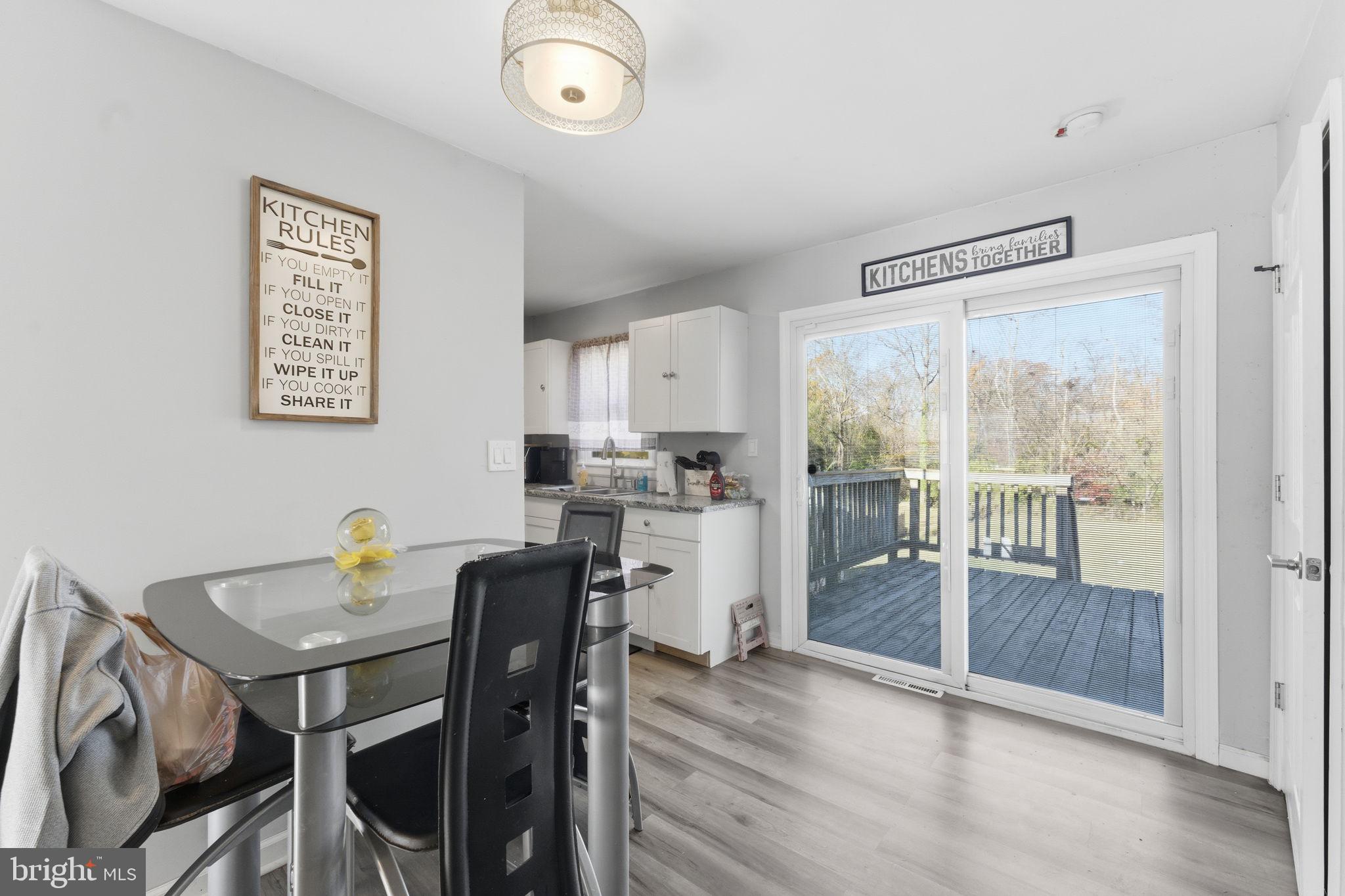 7812 Amherst Drive Manassas, VA 20111 - Photo 7 of 36 a view of a dining room with furniture and a window