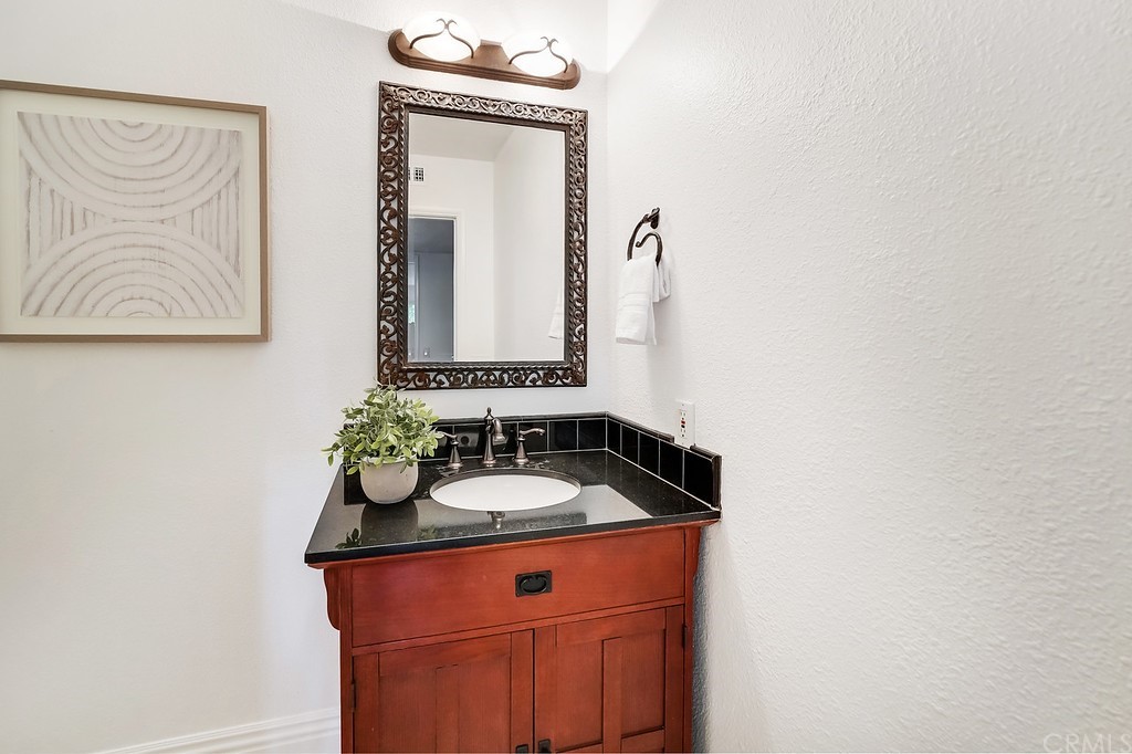 1902 Derby Drive North Tustin, CA 92705 - Photo 17 of 67 a bathroom with a sink and a mirror