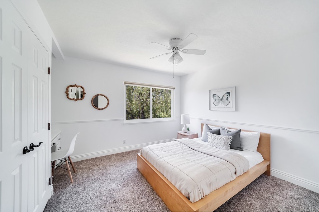 1902 Derby Drive North Tustin, CA 92705 - Photo 29 of 67 a bedroom with a large bed and a window