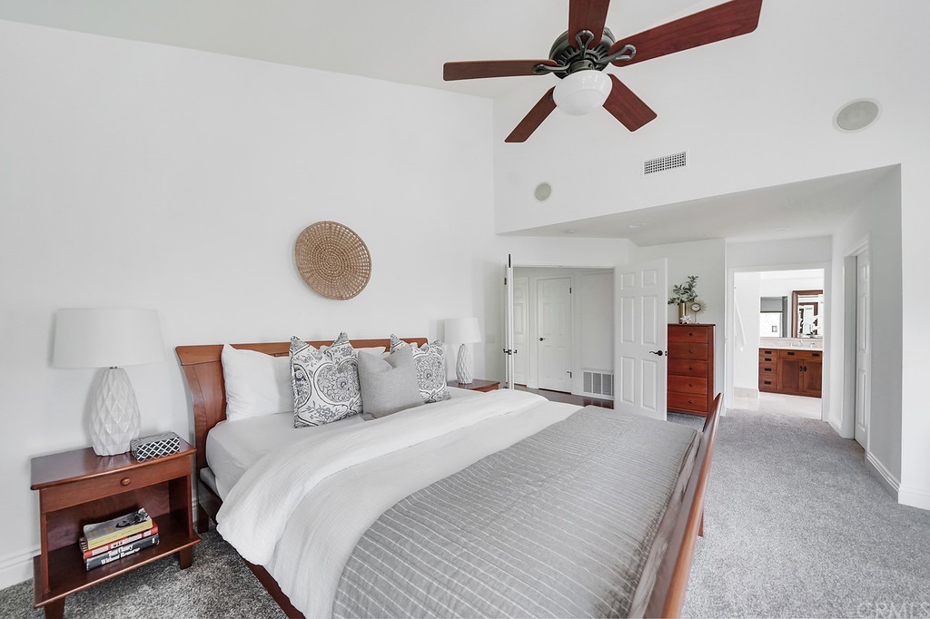 1902 Derby Drive North Tustin, CA 92705 - Photo 35 of 67 a bedroom with a bed and a chandelier