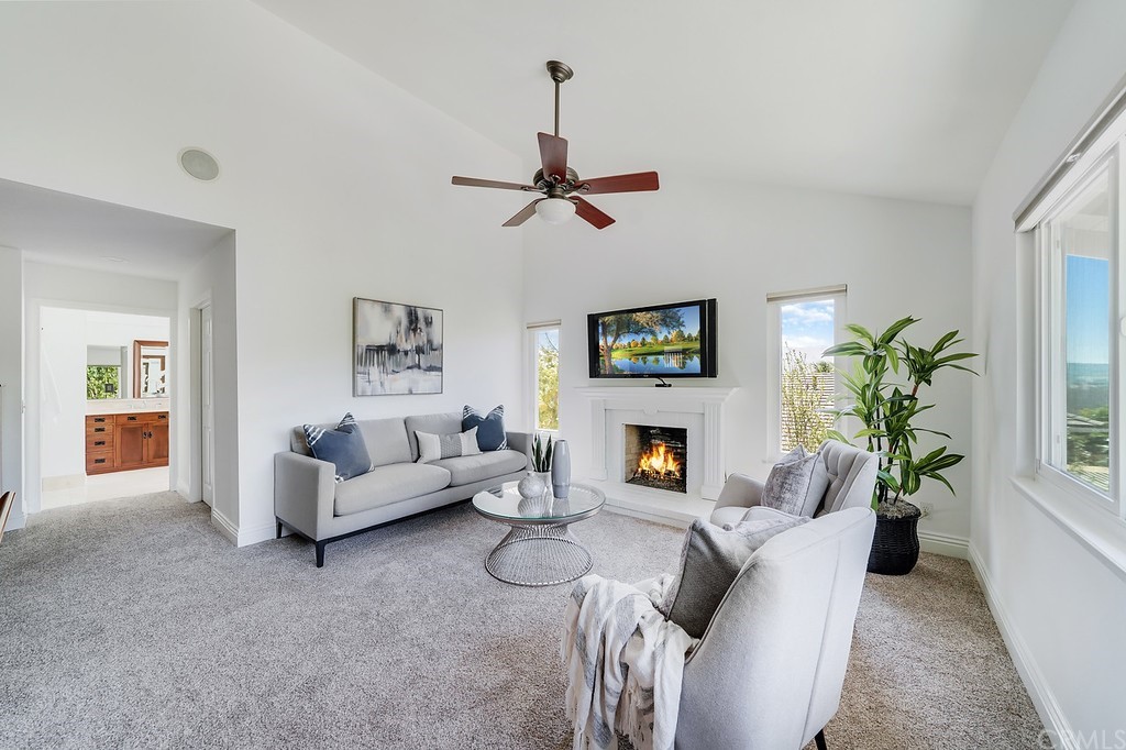1902 Derby Drive North Tustin, CA 92705 - Photo 36 of 67 a living room with furniture a fireplace and a potted plant