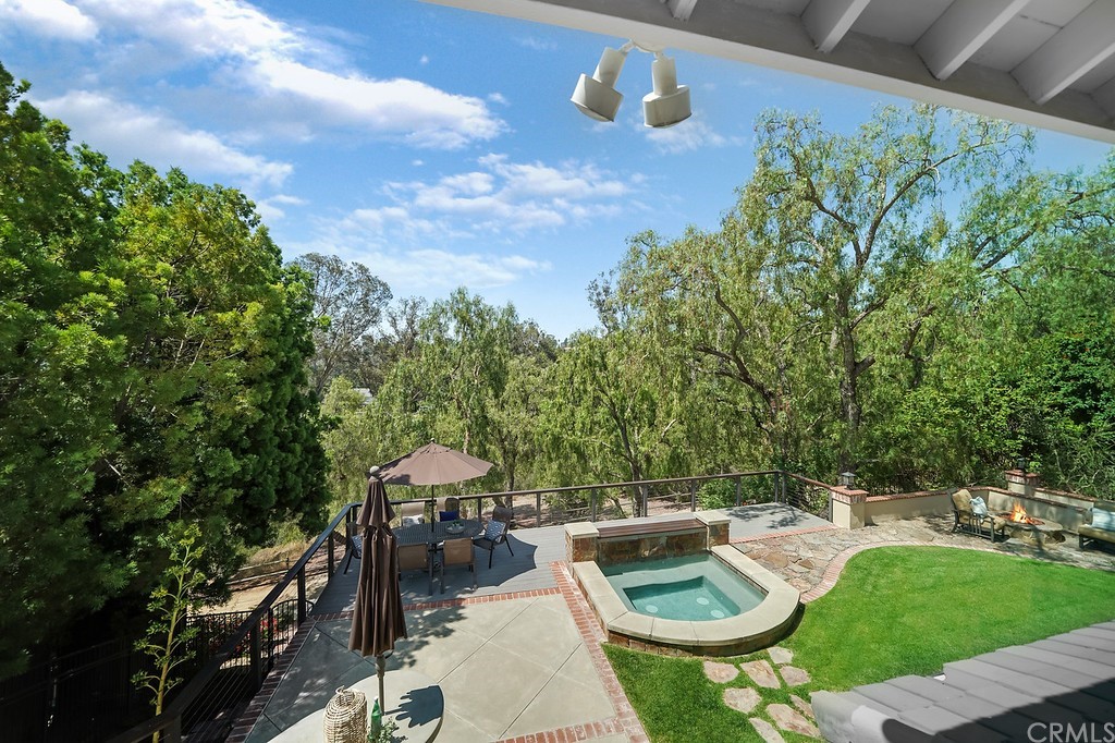 1902 Derby Drive North Tustin, CA 92705 - Photo 42 of 67 a view of a patio with couches table and chairs with potted plants and a yard