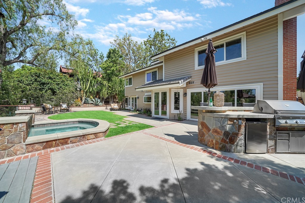 1902 Derby Drive North Tustin, CA 92705 - Photo 47 of 67 a front view of a house with a yard table and chairs