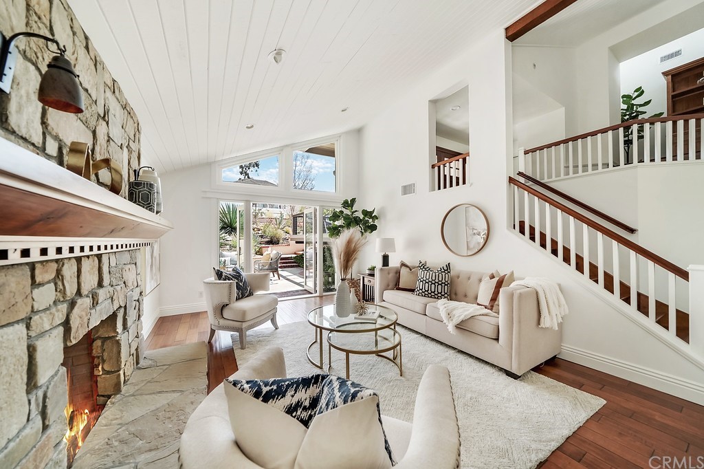 1902 Derby Drive North Tustin, CA 92705 - Photo 8 of 67 a living room with furniture a fireplace and a window