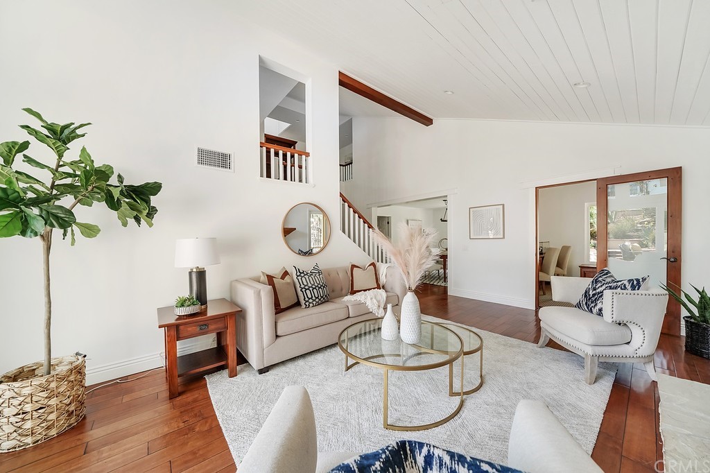 1902 Derby Drive North Tustin, CA 92705 - Photo 10 of 67 a living room with fireplace furniture and a wooden floor