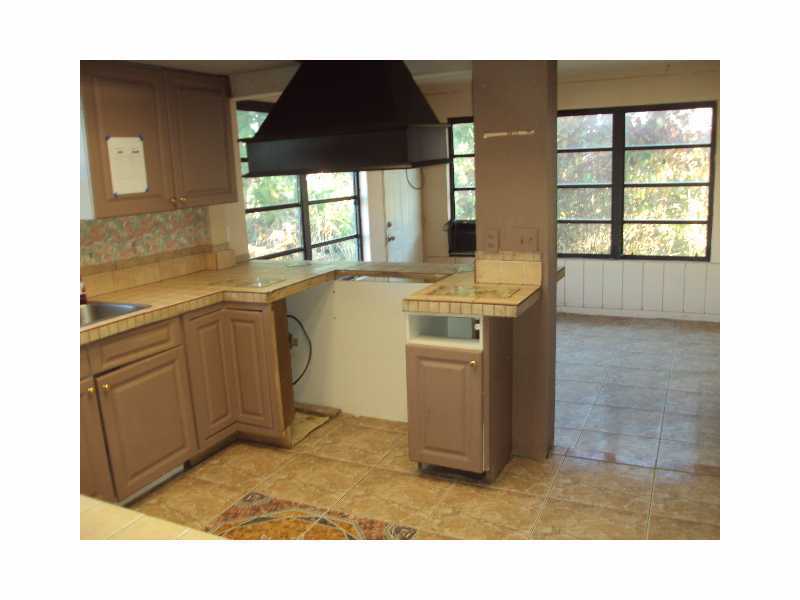 1758 Mistletoe Street Sebastian, FL 32958 - Photo 6 of 13 a kitchen with a stove a refrigerator and a sink