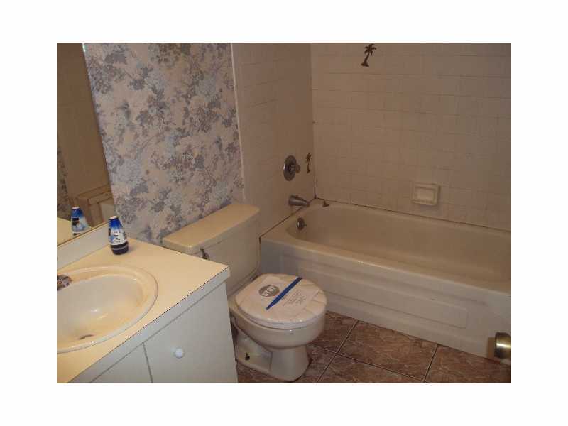 1758 Mistletoe Street Sebastian, FL 32958 - Photo 7 of 13 a bathroom with a sink toilet vanity and bathtub