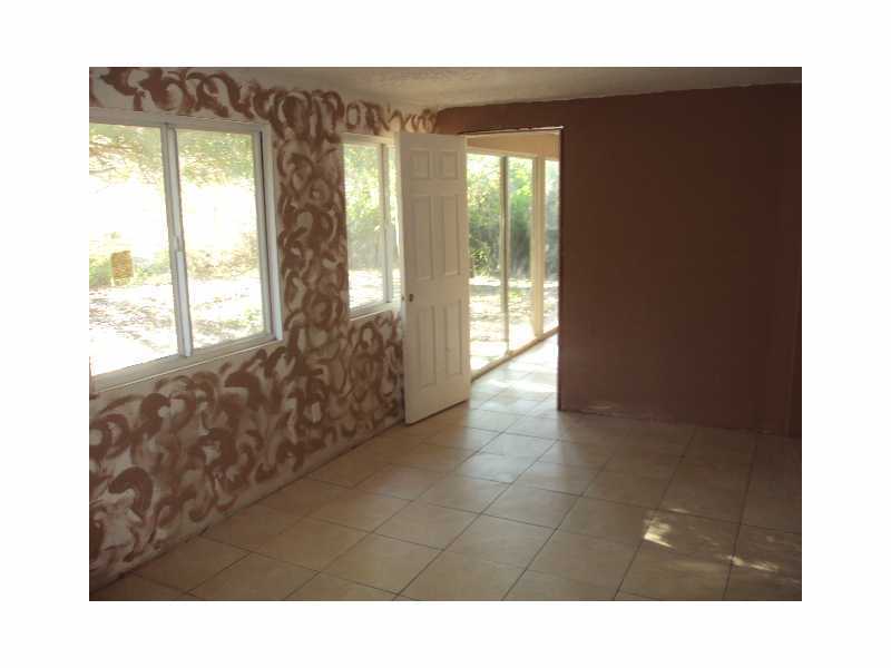 1758 Mistletoe Street Sebastian, FL 32958 - Photo 10 of 13 a living room with furniture and large windows