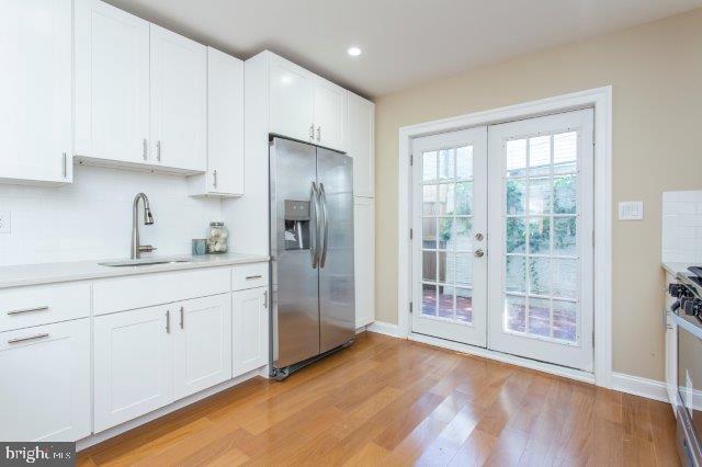 2026 McClellan Street Philadelphia, PA 19145 - Photo 11 of 32 a kitchen with stainless steel appliances granite countertop a refrigerator and a sink