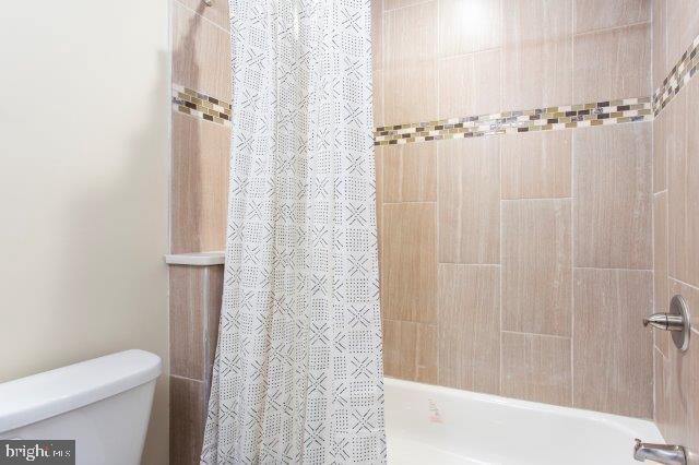 2026 McClellan Street Philadelphia, PA 19145 - Photo 20 of 32 a bathroom with a shower and a toilet