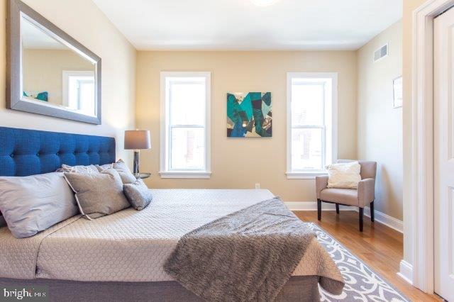 2026 McClellan Street Philadelphia, PA 19145 - Photo 21 of 32 a bedroom with a bed and a couch