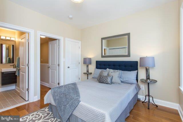 2026 McClellan Street Philadelphia, PA 19145 - Photo 24 of 32 a bedroom with a bed and a lamp