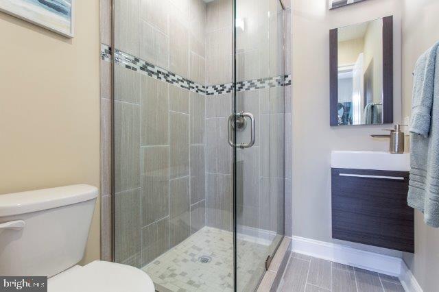 2026 McClellan Street Philadelphia, PA 19145 - Photo 25 of 32 a bathroom with a shower and a toilet