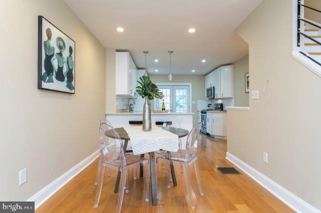 2026 McClellan Street Philadelphia, PA 19145 - Photo 5 of 32 a view of a dining room with furniture and wooden floor