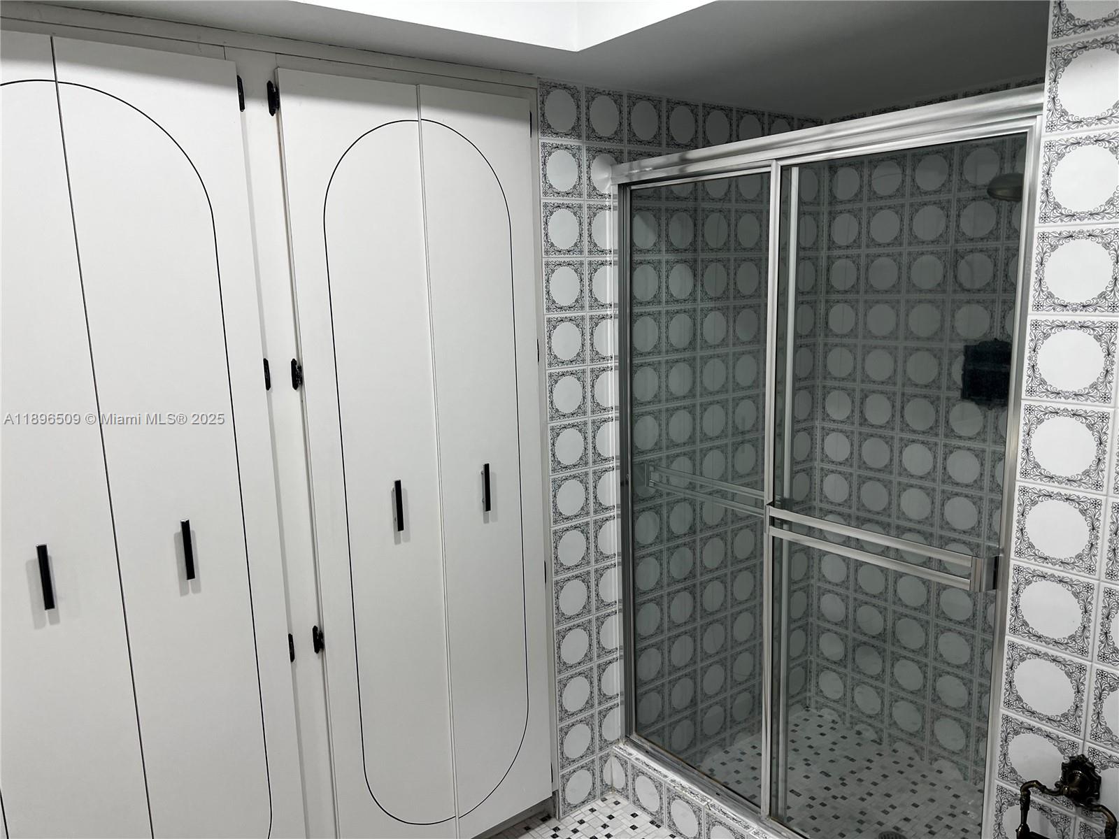 7751 Southwest 131st Street Pinecrest, FL 33156 - Photo 16 of 23 a bathroom with a shower