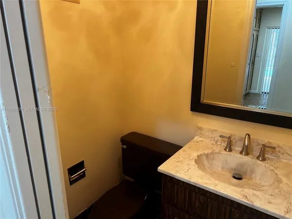 a view of an empty room with a fireplace