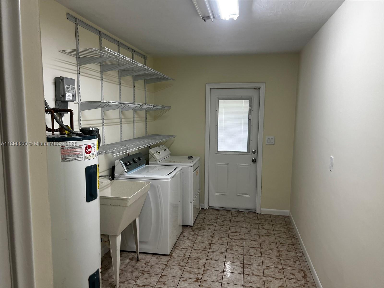 7751 Southwest 131st Street Pinecrest, FL 33156 - Photo 21 of 23 a room with storage and utility