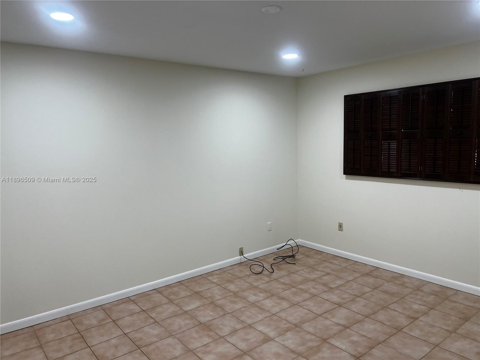 7751 Southwest 131st Street Pinecrest, FL 33156 - Photo 6 of 23 a view of an empty room