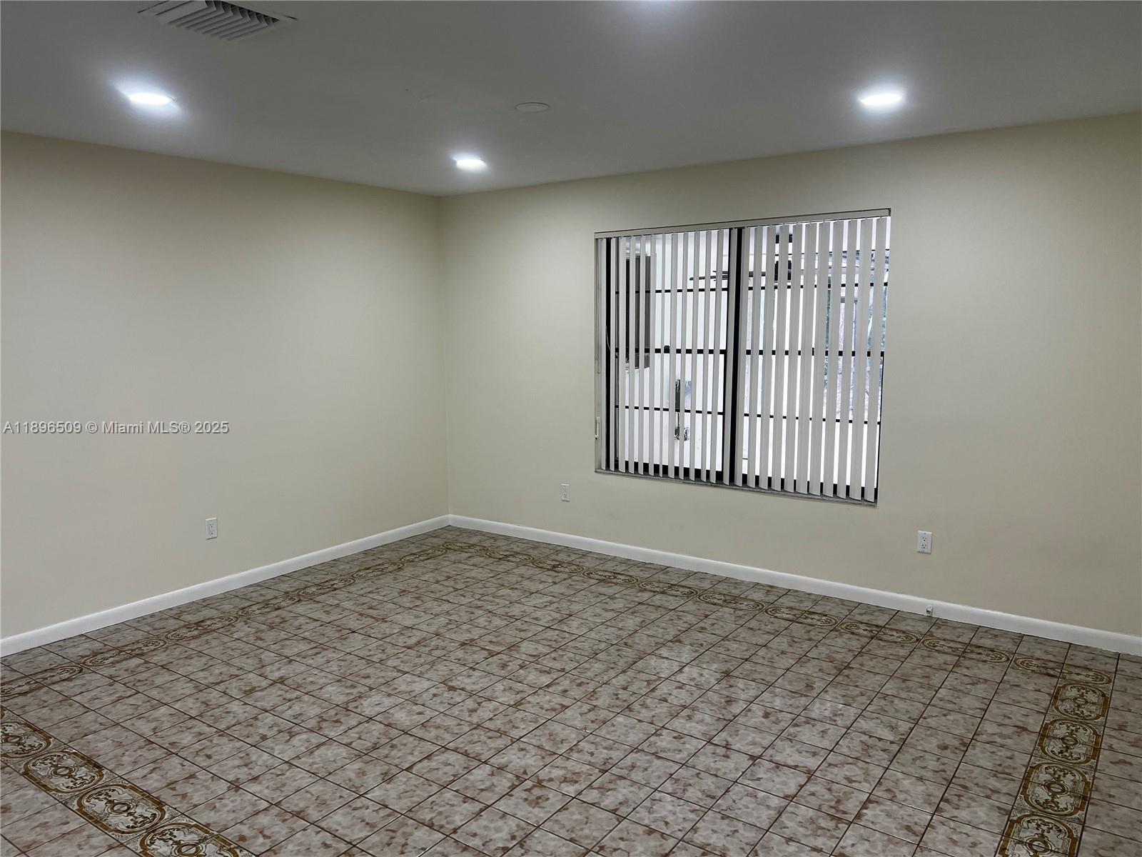 7751 Southwest 131st Street Pinecrest, FL 33156 - Photo 10 of 23 en empty room with windows