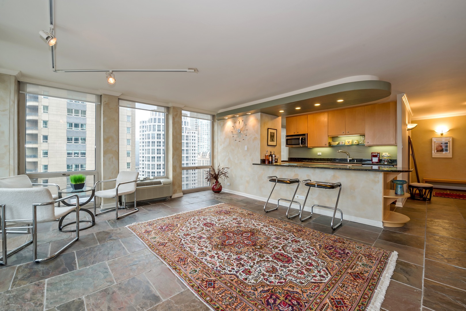 111 East Chestnut Street, Unit 29K Chicago, IL 60611 - Photo 5 of 10 a living room with furniture and a table