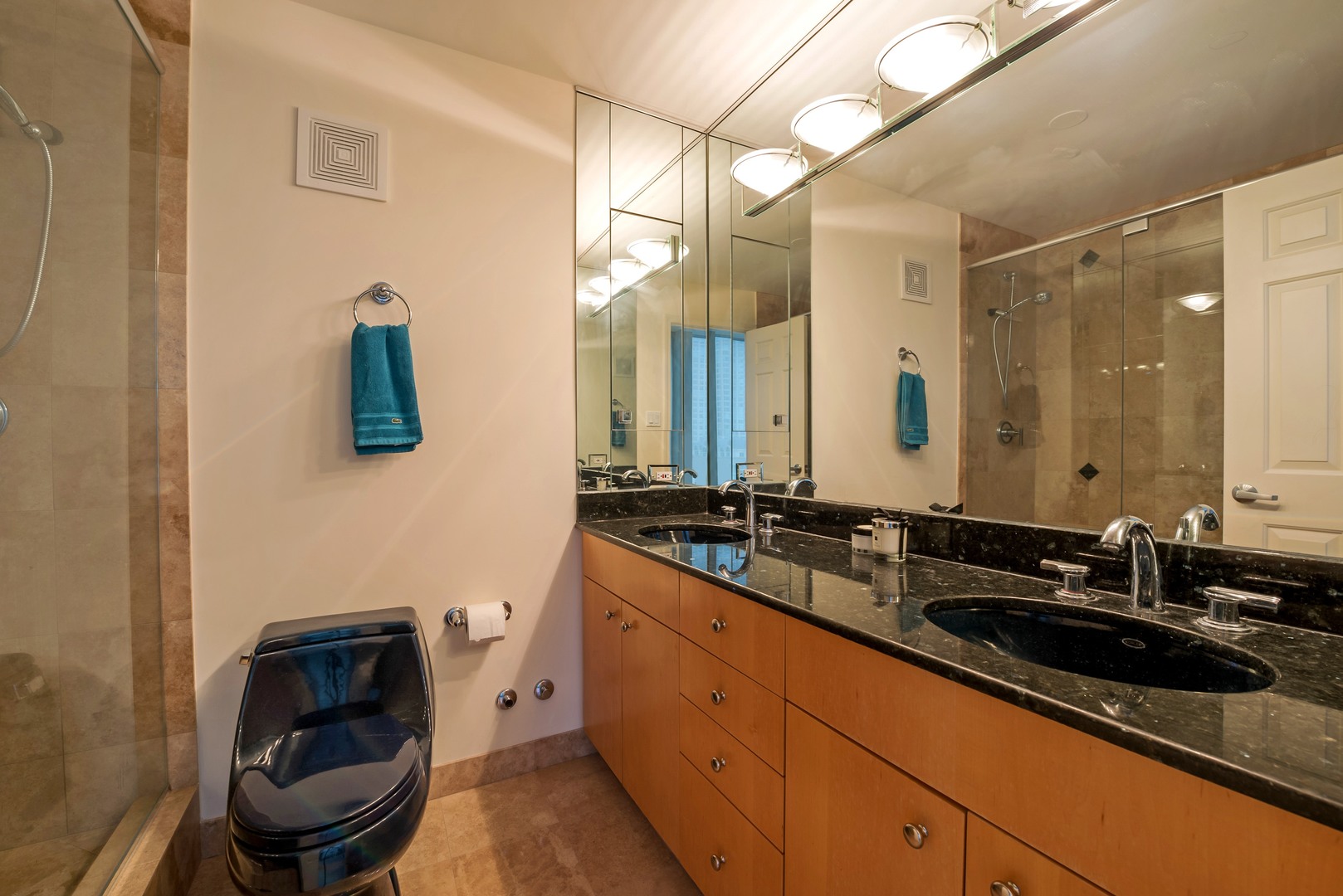 111 East Chestnut Street, Unit 29K Chicago, IL 60611 - Photo 7 of 10 a bathroom with a double vanity sink and a mirror