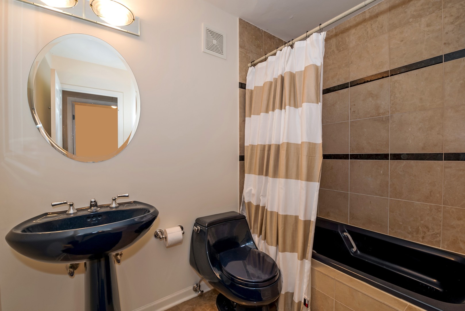 111 East Chestnut Street, Unit 29K Chicago, IL 60611 - Photo 9 of 10 a bathroom with a sink and a mirror