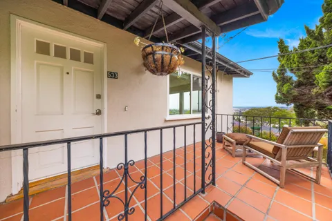 a kitchen with stainless steel appliances granite countertop a refrigerator sink and white cabinets