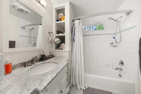 a view of a pathway with a tree