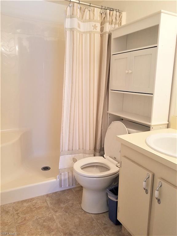 4363 27th Court Southwest, Unit 2103 Naples, FL 34116 - Photo 11 of 15 a bathroom with a sink and a toilet