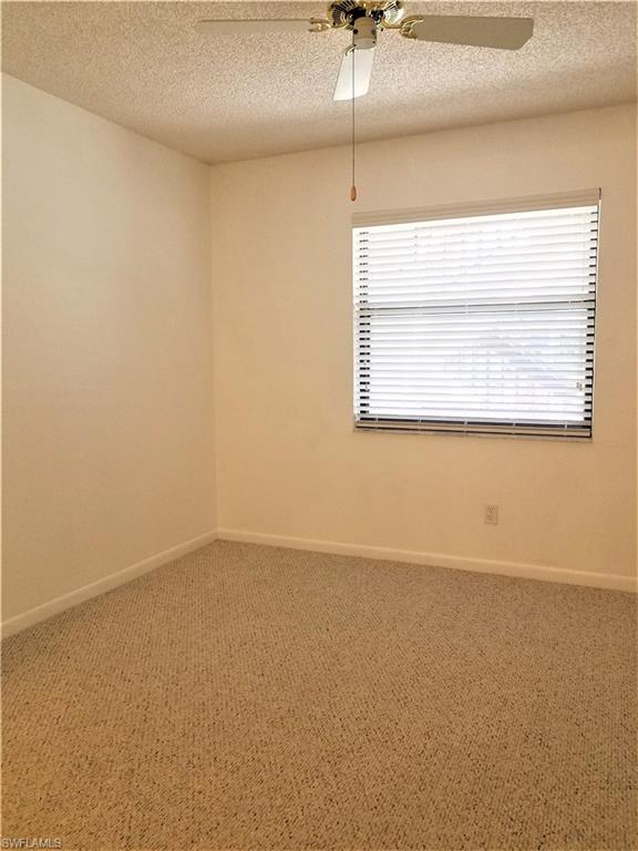 4363 27th Court Southwest, Unit 2103 Naples, FL 34116 - Photo 13 of 15 an empty room with a window