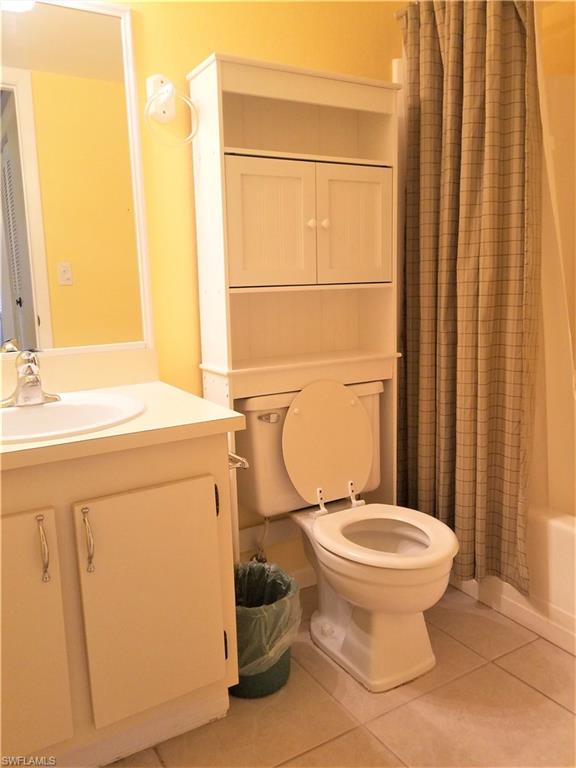 4363 27th Court Southwest, Unit 2103 Naples, FL 34116 - Photo 14 of 15 a bathroom with a sink toilet and shower