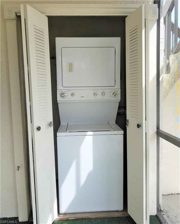 4363 27th Court Southwest, Unit 2103 Naples, FL 34116 - Photo 15 of 15 a utility room with a washer and dryer