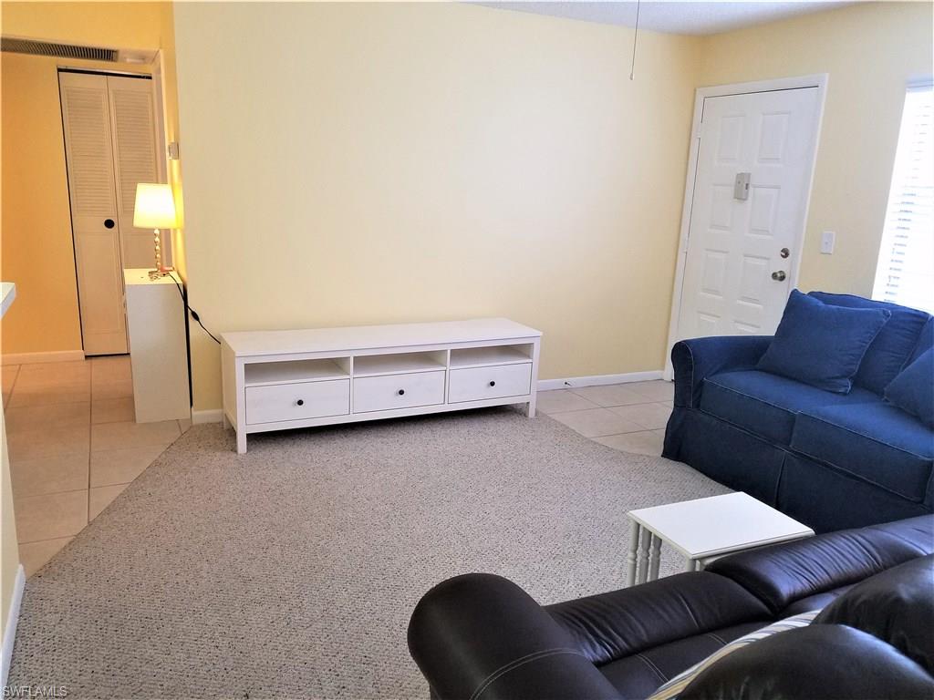 4363 27th Court Southwest, Unit 2103 Naples, FL 34116 - Photo 3 of 15 a living room with furniture and a couch