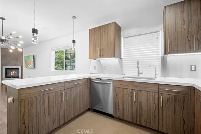 a kitchen with a sink window and cabinets