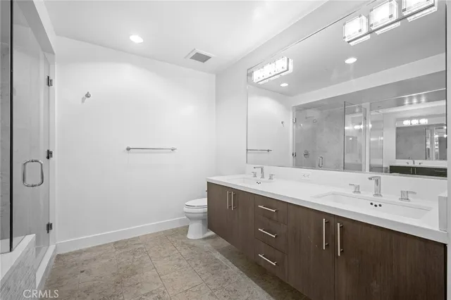 a bathroom with a double vanity sink mirror and double