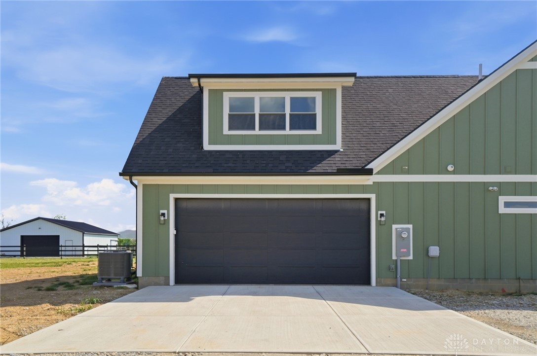 9364 Kenrick Road Dayton, OH 45458 - Photo 55 of 62 This newly constructed property offers a spacious garage and contemporary architectural design.